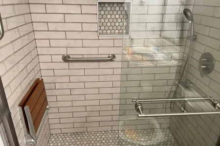 modern-shower-upgrade-knoxville-tn.webp Modern shower remodel in Knoxville, TN with wall-mounted fixtures and clean, minimal tile design