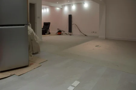 finished-basement-remodel-knoxville-tennessee.webp Finished basement remodel in Knoxville, Tennessee featuring entertainment area, recessed lighting, and luxury vinyl flooring